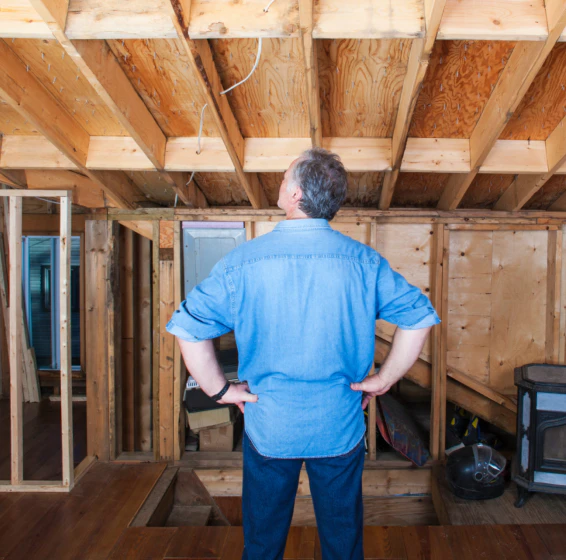 contractor looking over work on home addition